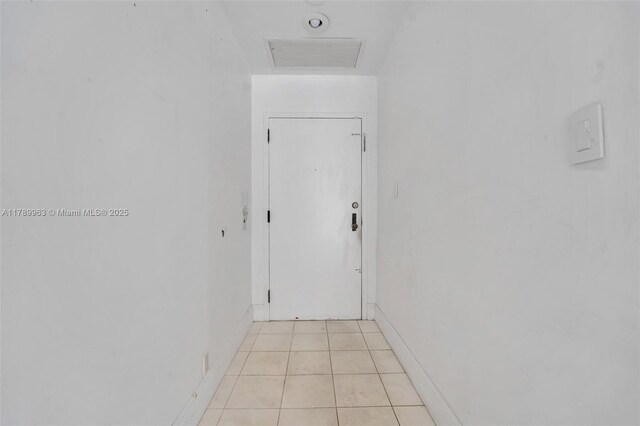 151 Crandon Blvd Unit 138, Key Biscayne, FL 33149 - hallway with visible vents, baseboards, and light tile patterned floors