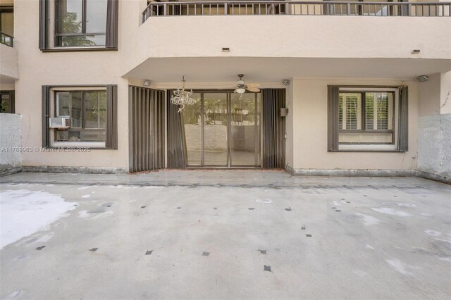 151 Crandon Blvd Unit 138, Key Biscayne, FL 33149 - view of exterior entry featuring ceiling fan and stucco siding