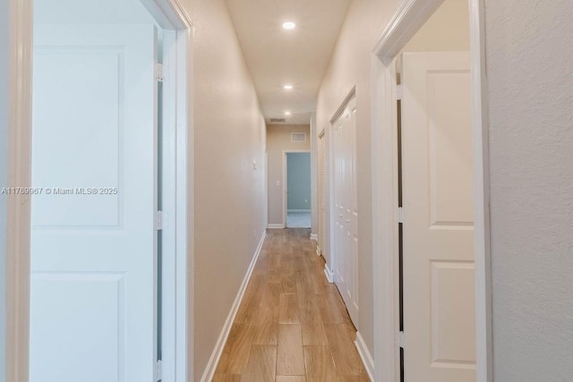 12950 SW 235th Ter, Homestead, FL 33032 - hallway with baseboards, light wood-style floors, and recessed lighting