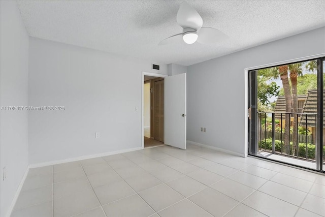 2412 24th Way, West Palm Beach, FL 33407 - spare room with light tile patterned floors, ceiling fan, visible vents, baseboards, and a textured ceiling