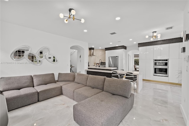 stairway featuring marble finish floor, baseboards, and recessed lighting