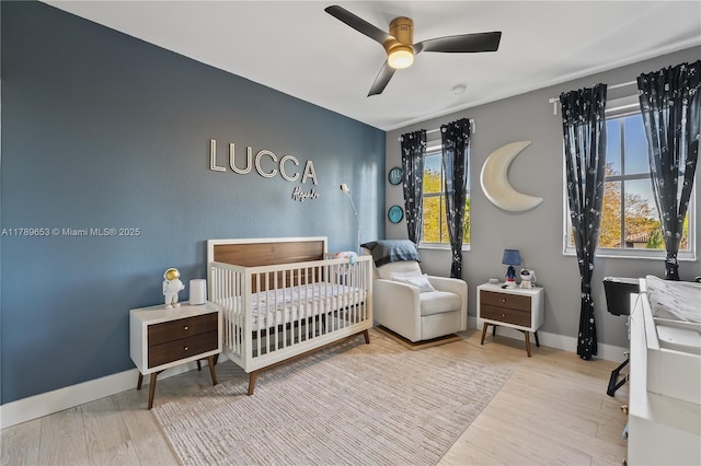 bedroom with recessed lighting, a tray ceiling, visible vents, and light wood-style flooring