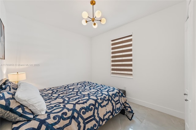 bedroom featuring a crib, a ceiling fan, wood finished floors, and multiple windows