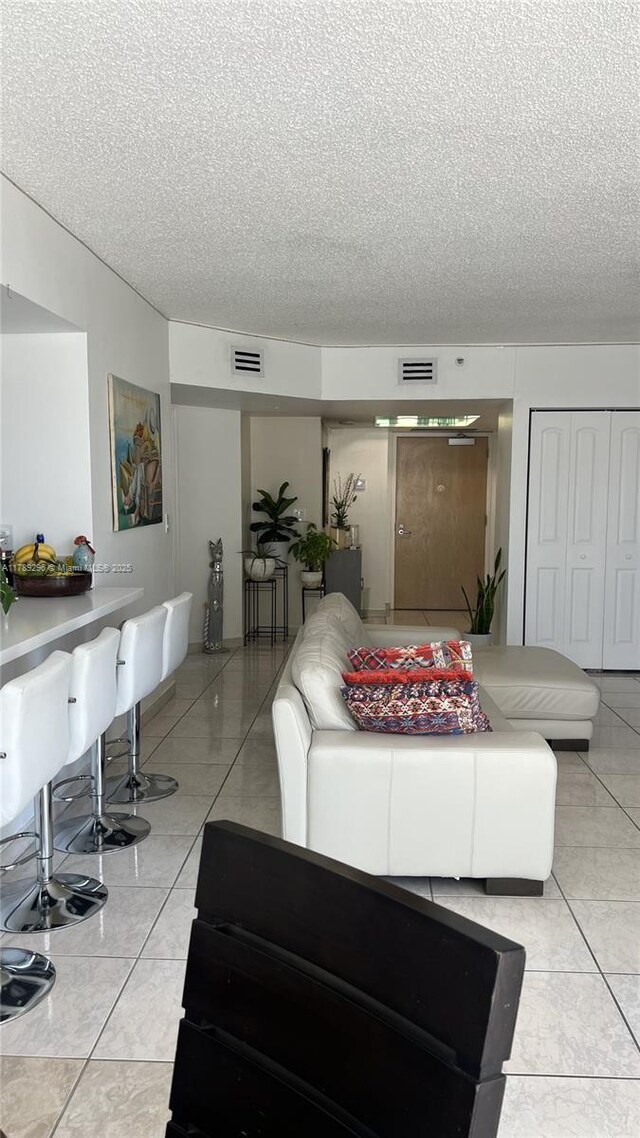 16485 E Collins Ave Unit 338, Sunny Isles Beach, FL 33160 - living room with a textured ceiling and visible vents