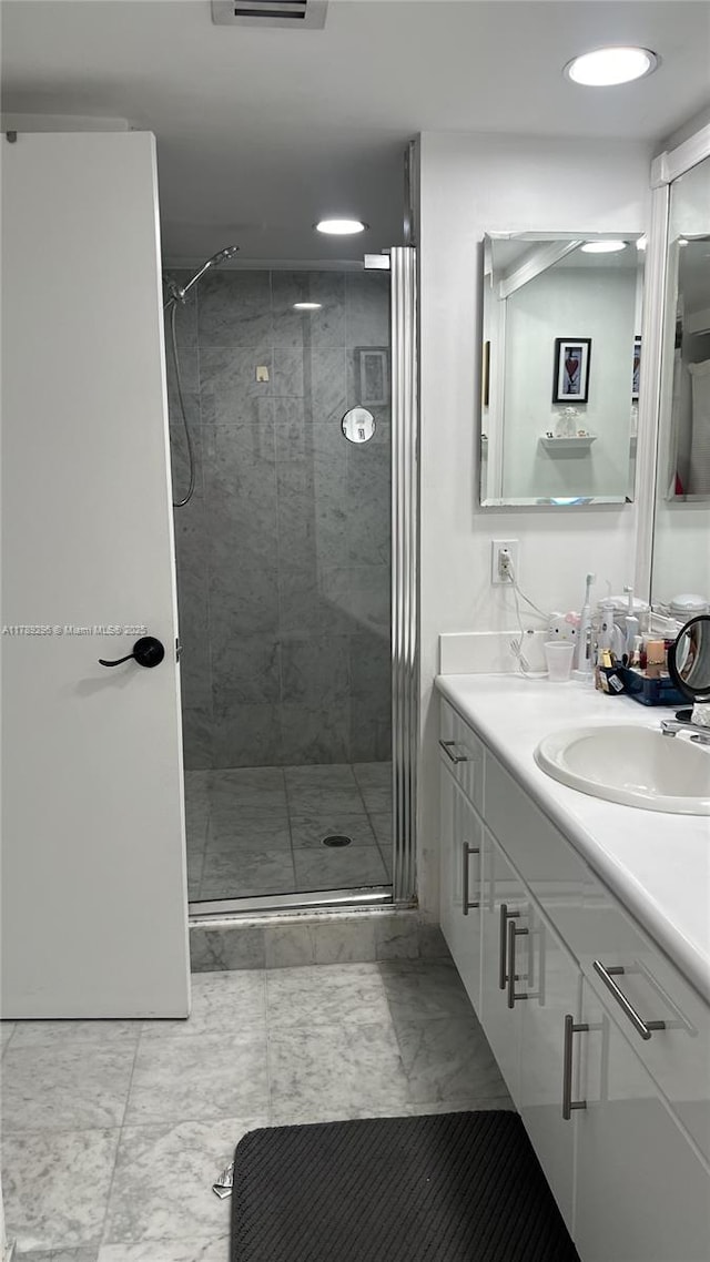 16485 E Collins Ave Unit 338, Sunny Isles Beach, FL 33160 - bathroom with vanity, recessed lighting, marble finish floor, and a stall shower