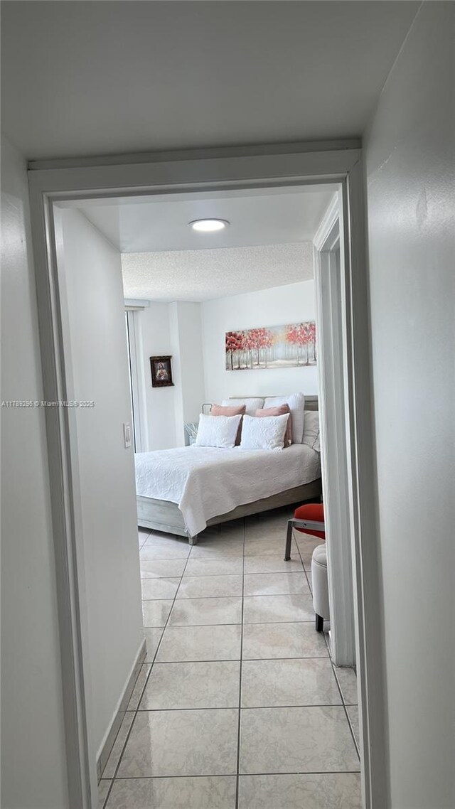 16485 E Collins Ave Unit 338, Sunny Isles Beach, FL 33160 - bedroom with light tile patterned floors