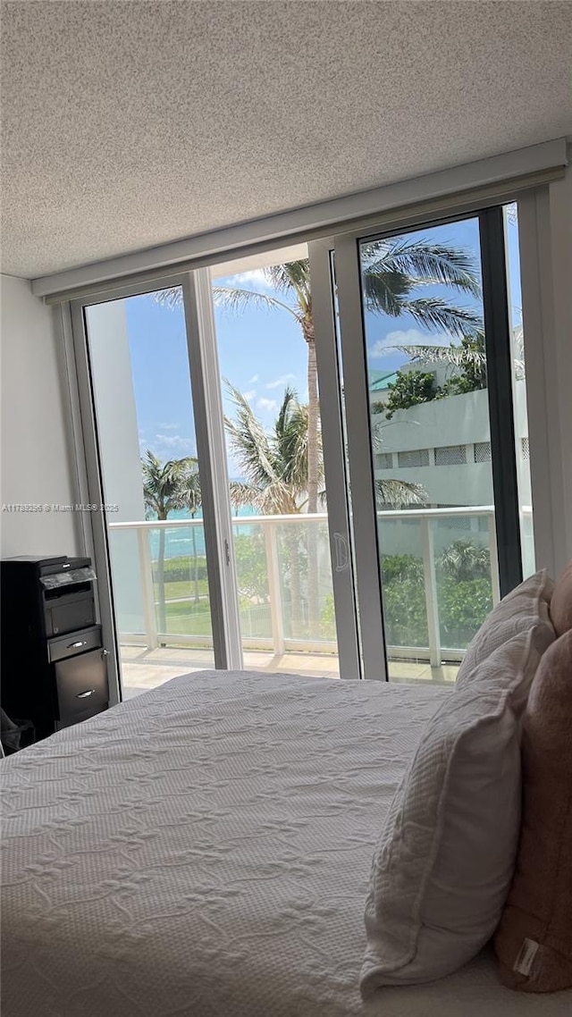 16485 E Collins Ave Unit 338, Sunny Isles Beach, FL 33160 - bedroom featuring multiple windows and access to exterior