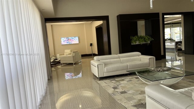 16485 E Collins Ave Unit 338, Sunny Isles Beach, FL 33160 - living area with light tile patterned flooring