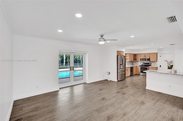 15440 SW 81st Ave, Palmetto Bay, FL 33157 - living room featuring wood finished floors, recessed lighting, ceiling fan, baseboards, and french doors
