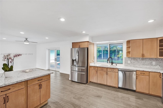 15440 SW 81st Ave, Palmetto Bay, FL 33157 - kitchen featuring appliances with stainless steel finishes, a sink, light stone countertops, healthy amount of natural light, and recessed lighting