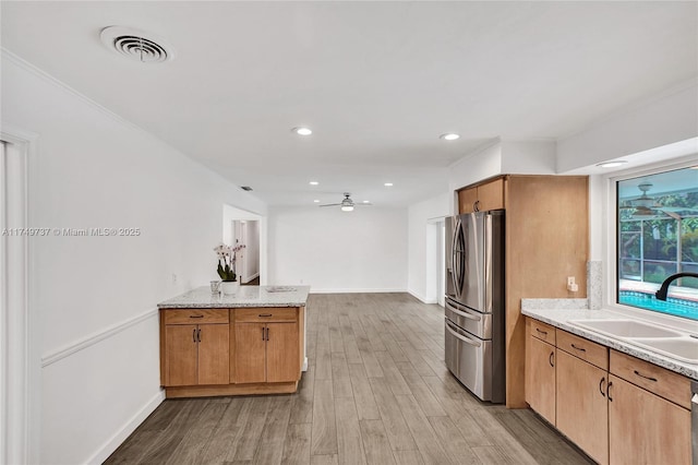 15440 SW 81st Ave, Palmetto Bay, FL 33157 - kitchen featuring stainless steel fridge with ice dispenser, a sink, light wood-style flooring, baseboards, and ceiling fan