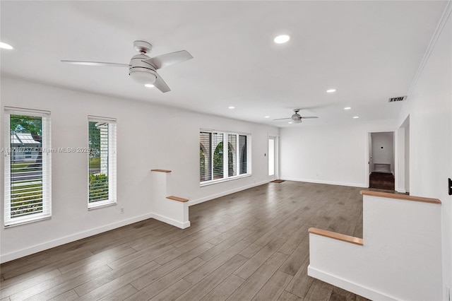 15440 SW 81st Ave, Palmetto Bay, FL 33157 - unfurnished living room featuring a ceiling fan, wood finished floors, baseboards, and recessed lighting