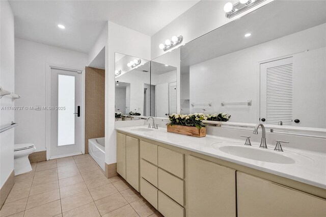 15440 SW 81st Ave, Palmetto Bay, FL 33157 - bathroom with double vanity, a bath, tile patterned floors, and toilet