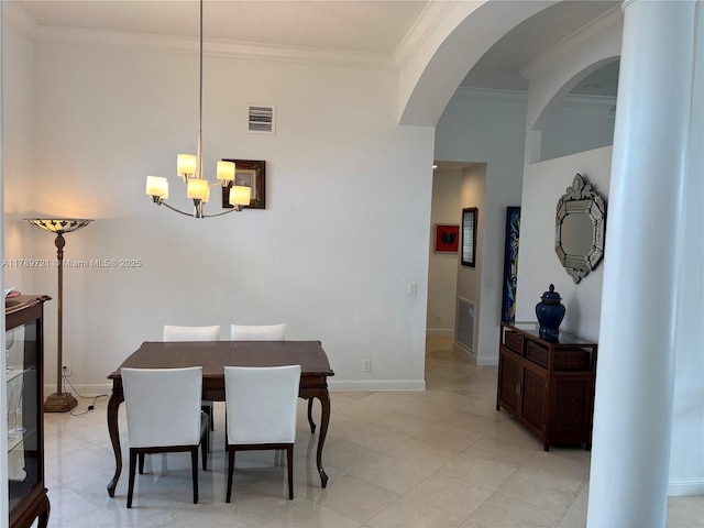 320 Windmill Palm Ave, Plantation, FL 33324 - dining area featuring a chandelier, ornamental molding, arched walkways, and light tile patterned flooring