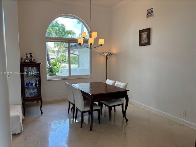 320 Windmill Palm Ave, Plantation, FL 33324 - dining space featuring a chandelier, light tile patterned floors, and ornamental molding