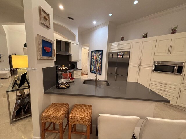 320 Windmill Palm Ave, Plantation, FL 33324 - kitchen with appliances with stainless steel finishes, dark countertops, ornamental molding, wall chimney exhaust hood, and a peninsula