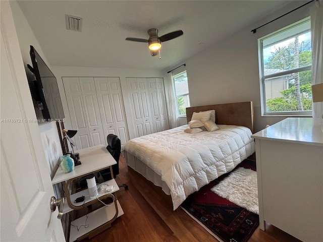 320 Windmill Palm Ave, Plantation, FL 33324 - bedroom featuring two closets, wood finished floors, and a ceiling fan