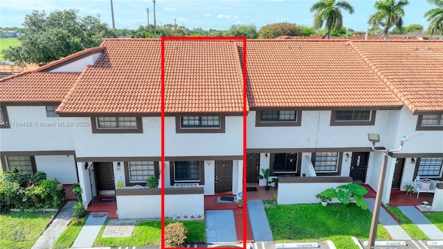 13250 SW 58th Ter Unit 10-8, Miami, FL 33183 - view of front facade featuring stucco siding, a tile roof, and covered porch