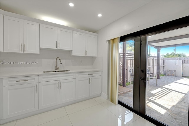 13250 SW 58th Ter Unit 10-8, Miami, FL 33183 - kitchen with white cabinets, plenty of natural light, french doors, and a sink