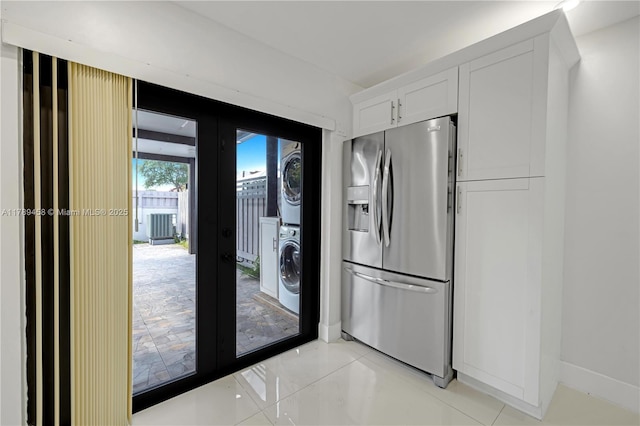 13250 SW 58th Ter Unit 10-8, Miami, FL 33183 - kitchen featuring white cabinets, stainless steel fridge with ice dispenser, french doors, and stacked washing maching and dryer
