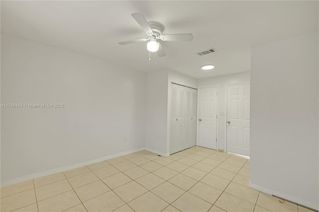 13250 SW 58th Ter Unit 10-8, Miami, FL 33183 - spare room featuring baseboards, a ceiling fan, visible vents, and light tile patterned floors