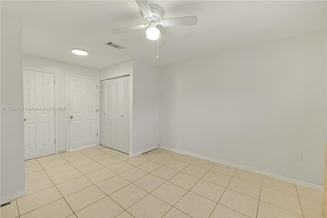 13250 SW 58th Ter Unit 10-8, Miami, FL 33183 - unfurnished bedroom with visible vents, light tile patterned floors, a closet, baseboards, and ceiling fan