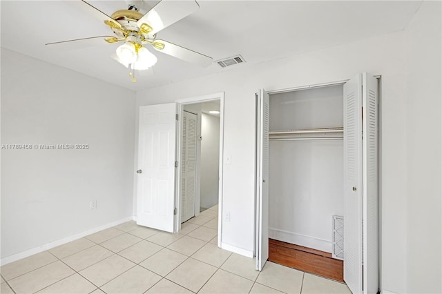 13250 SW 58th Ter Unit 10-8, Miami, FL 33183 - unfurnished bedroom featuring baseboards, visible vents, a ceiling fan, a closet, and light tile patterned floors