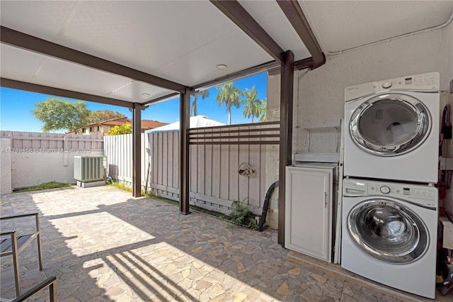 13250 SW 58th Ter Unit 10-8, Miami, FL 33183 - laundry area featuring stone flooring, plenty of natural light, stacked washer and dryer, and laundry area