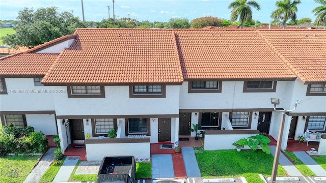 13250 SW 58th Ter Unit 10-8, Miami, FL 33183 - view of front of house featuring uncovered parking, a tiled roof, and stucco siding