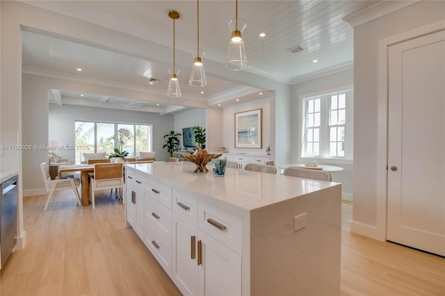kitchen featuring white cabinets, hanging light fixtures, light wood finished floors, a center island, and wood ceiling