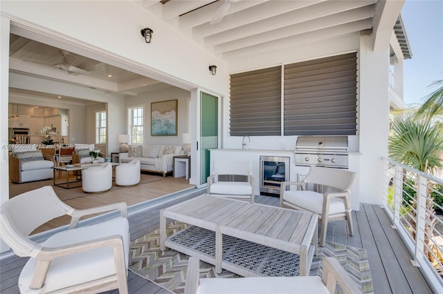 view of patio / terrace with an outdoor hangout area, wine cooler, and grilling area