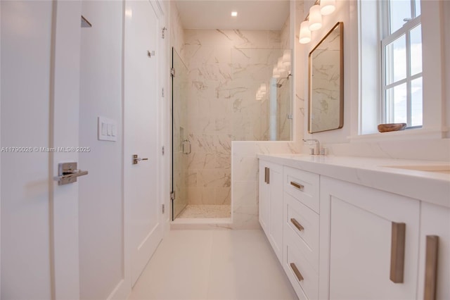 full bathroom with vanity, recessed lighting, and a marble finish shower