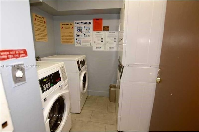 community laundry room with separate washer and dryer, stacked washer and clothes dryer, and light tile patterned floors