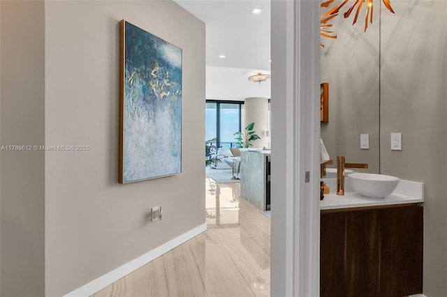 480 NE 31st St Unit 4701, Miami, FL 33137 - bathroom with vanity, marble finish floor, and baseboards
