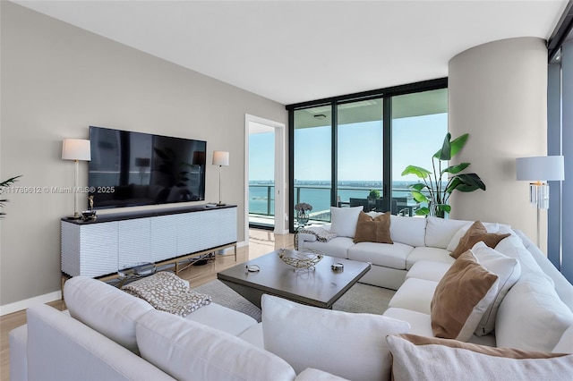 480 NE 31st St Unit 4701, Miami, FL 33137 - living area with baseboards, wood finished floors, and floor to ceiling windows