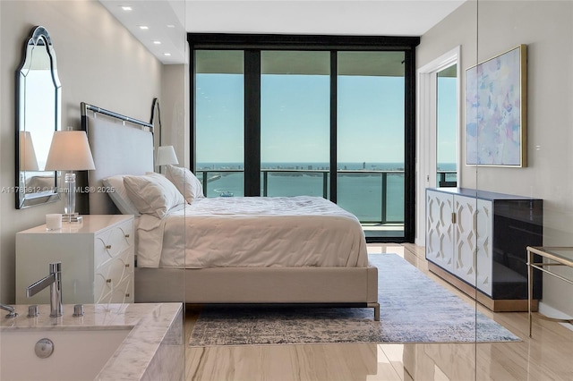 480 NE 31st St Unit 4701, Miami, FL 33137 - bedroom with expansive windows, access to outside, multiple windows, and a sink