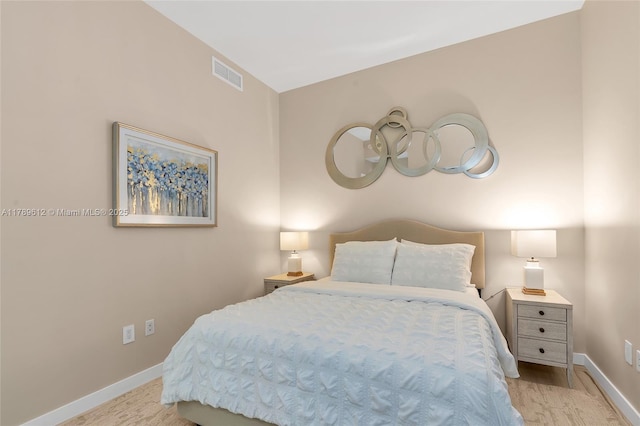 480 NE 31st St Unit 4701, Miami, FL 33137 - bedroom with baseboards, wood finished floors, and visible vents