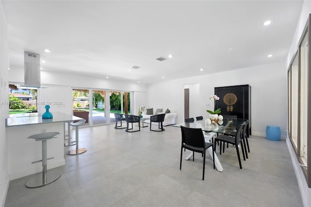 dining room with recessed lighting and visible vents