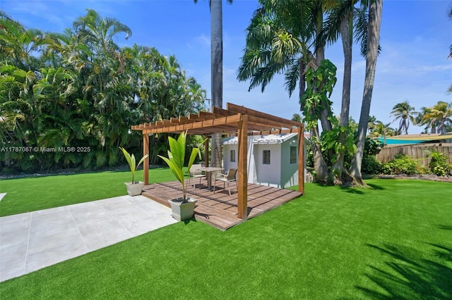 view of yard with fence, a pergola, and a patio area