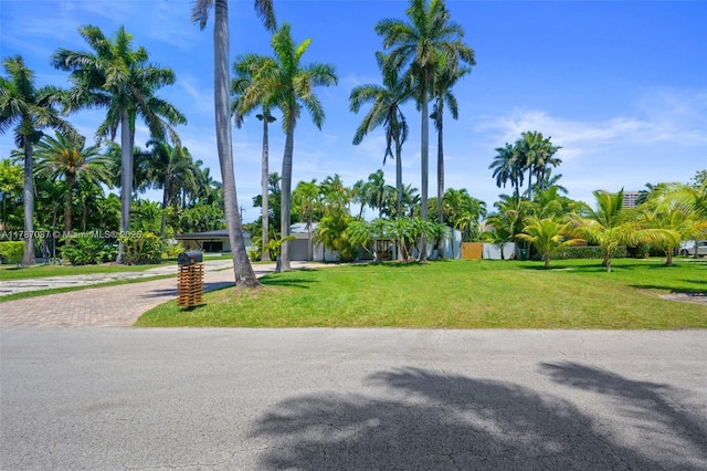 1511 NE 108th St, Miami, FL 33161 - view of property's community with a yard and decorative driveway