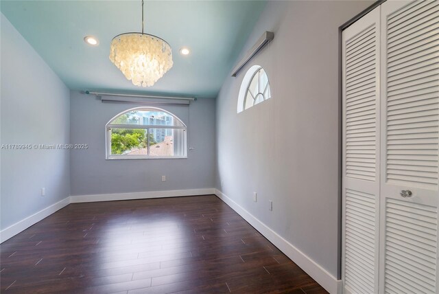 3769 NE 209th Ter, Aventura, FL 33180 - unfurnished dining area with healthy amount of natural light, a chandelier, wood finished floors, baseboards, and recessed lighting