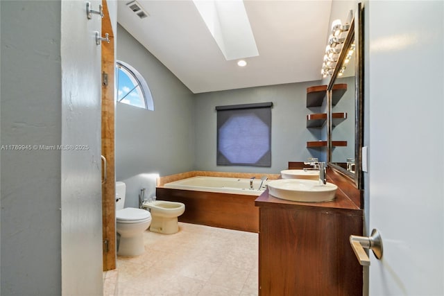 3769 NE 209th Ter, Aventura, FL 33180 - full bathroom featuring a skylight, a bidet, toilet, a bath, and vanity