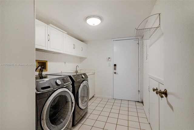 3769 NE 209th Ter, Aventura, FL 33180 - laundry room with washing machine and dryer, cabinet space, light tile patterned floors, and baseboards