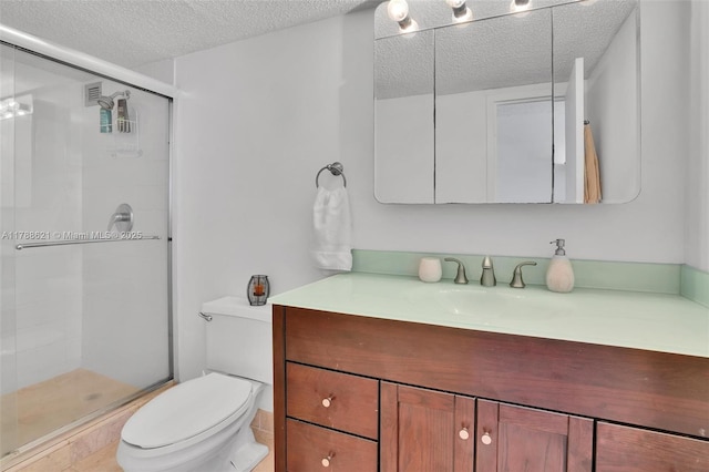 600 Parkview Dr Unit 422, Hallandale Beach, FL 33009 - bathroom featuring a textured ceiling, vanity, toilet, and a stall shower