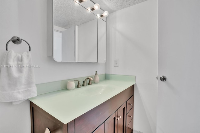 600 Parkview Dr Unit 422, Hallandale Beach, FL 33009 - bathroom featuring a textured ceiling and vanity