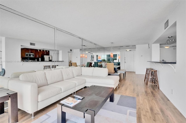 600 Parkview Dr Unit 422, Hallandale Beach, FL 33009 - living room with visible vents and light wood-type flooring