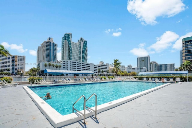 600 Parkview Dr Unit 422, Hallandale Beach, FL 33009 - pool featuring a view of city, a patio, and fence