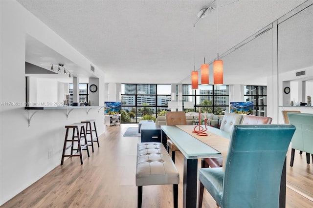 600 Parkview Dr Unit 422, Hallandale Beach, FL 33009 - dining room with track lighting, a textured ceiling, visible vents, and a wealth of natural light