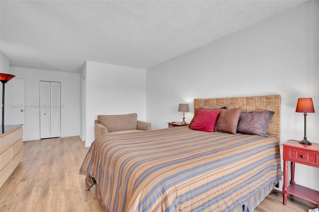 600 Parkview Dr Unit 422, Hallandale Beach, FL 33009 - bedroom featuring light wood finished floors and a textured ceiling