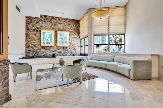 600 Parkview Dr Unit 422, Hallandale Beach, FL 33009 - living area with a towering ceiling, visible vents, and baseboards